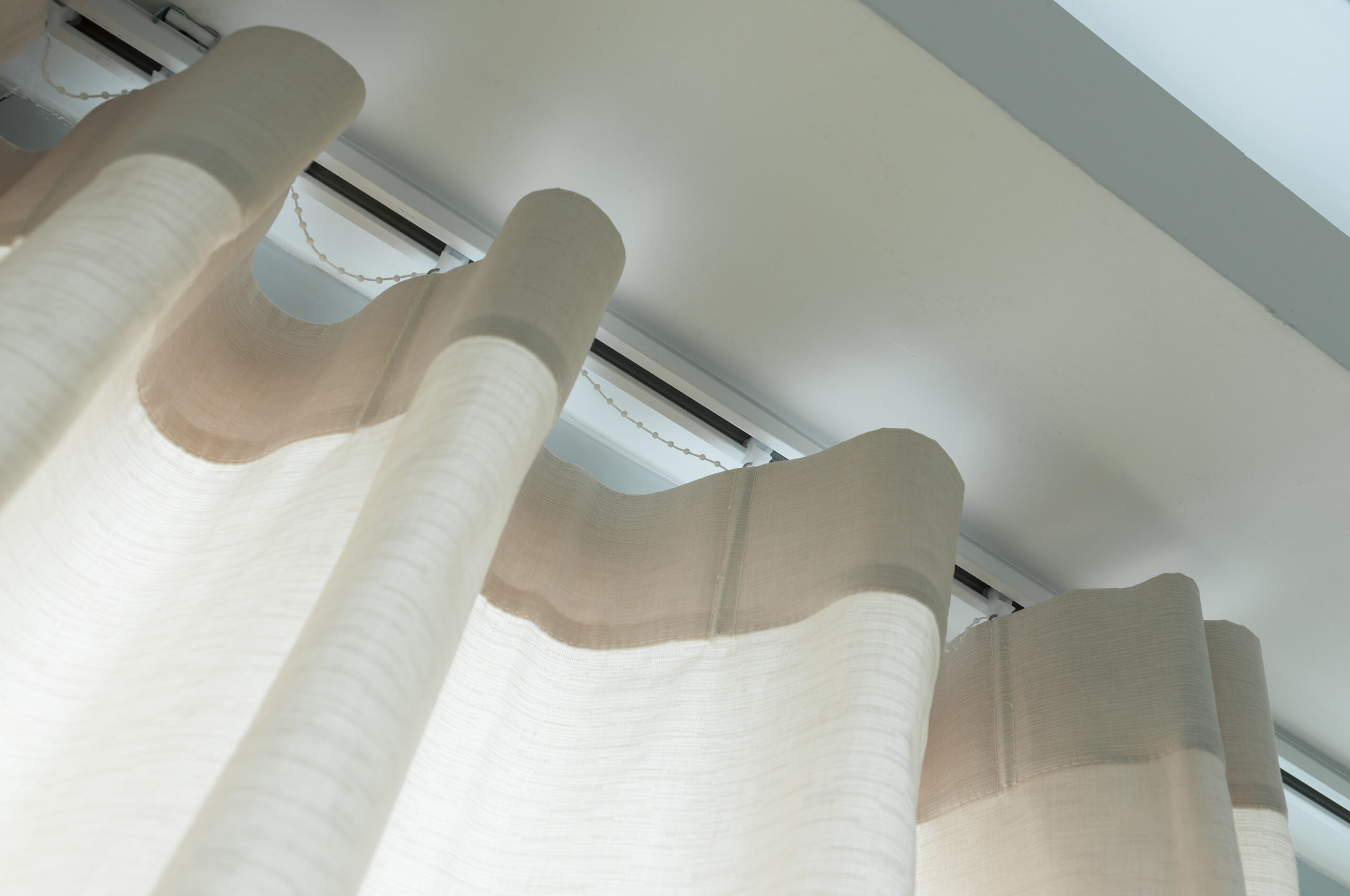 Close up of curtain  with curtain rails.