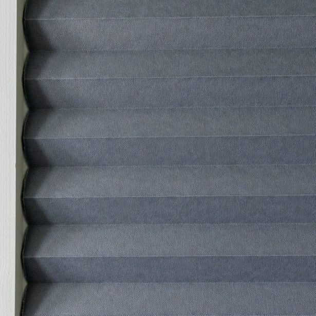 Texture of gray paper curtains inside a framed wooden door